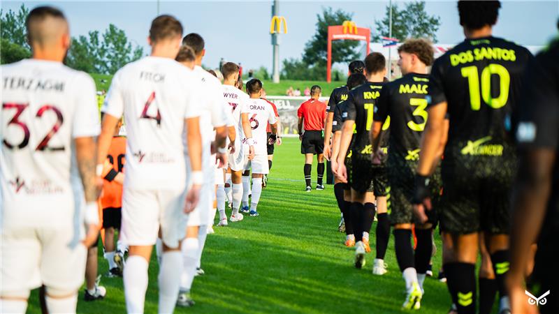 Omaha and Richmond players walking out onto the pitch